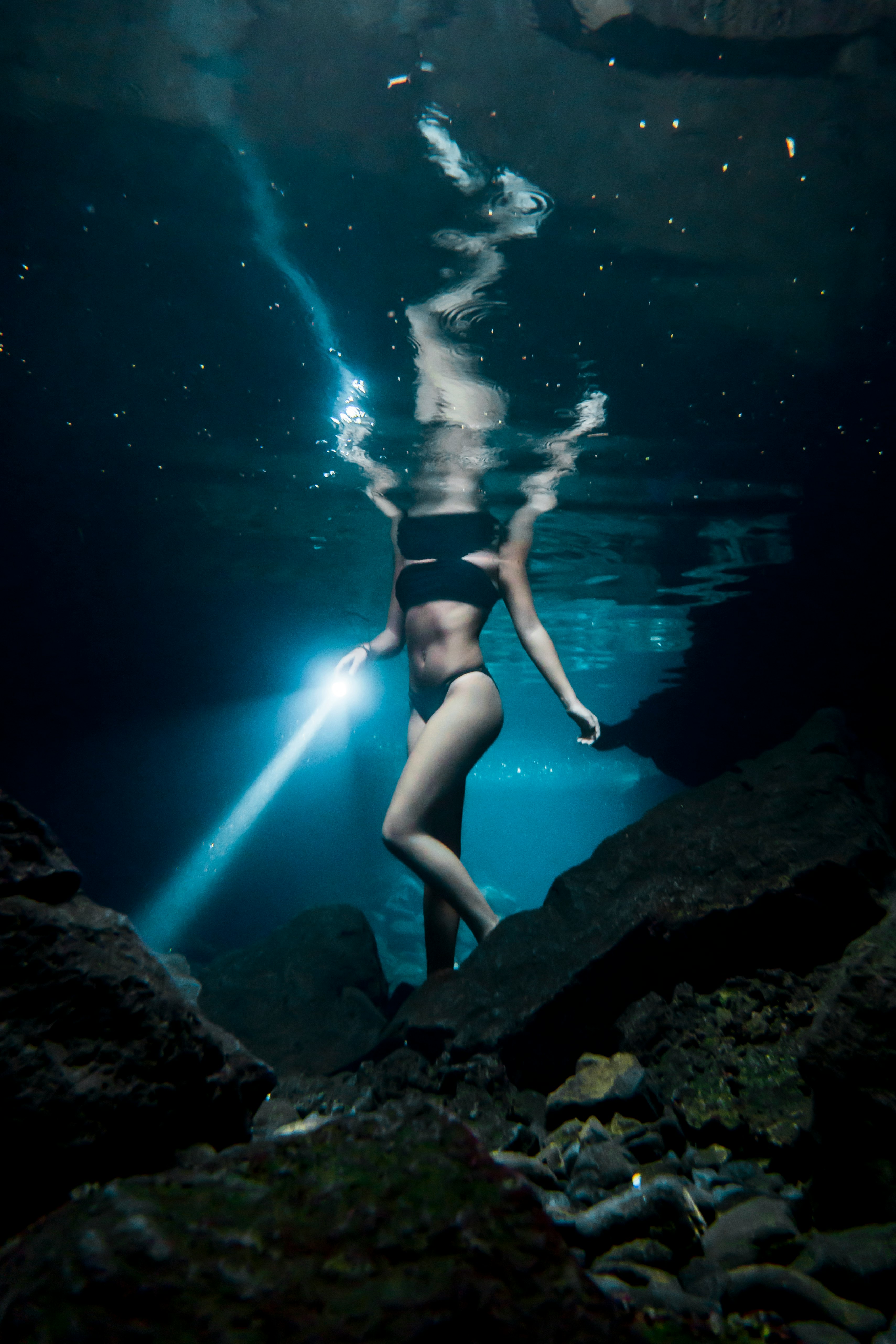 woman in blue bikini under water